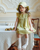 Happyology girl wearing a dress from the collection