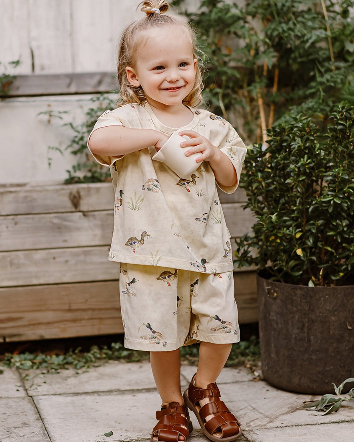 Happyology boy wearing a shirt and shorts set