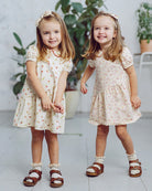 Two children in Happyology dresses