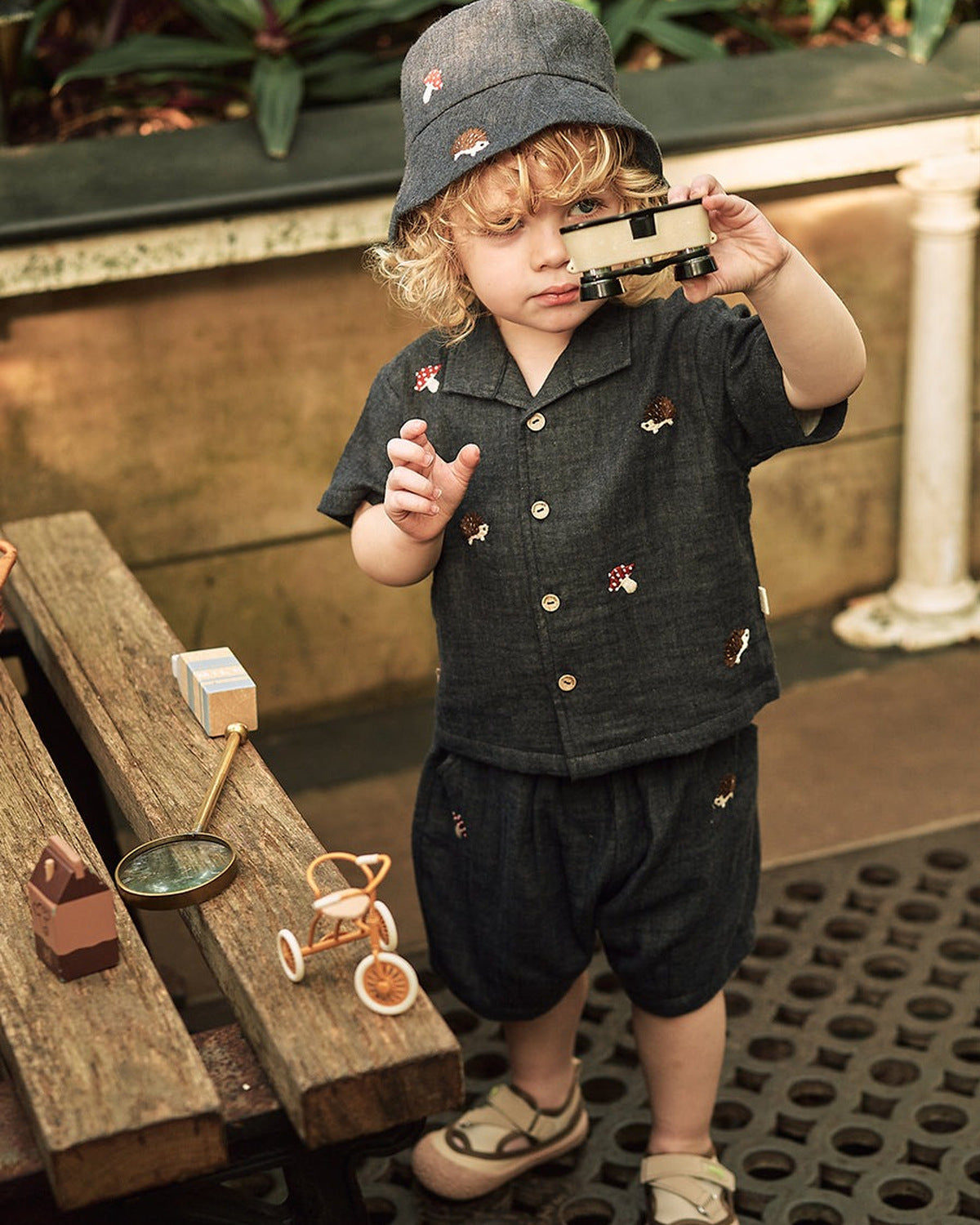 Happyology boy wearing a shirt and shorts set